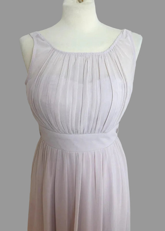 Light purple dress on a mannequin against a plain background
